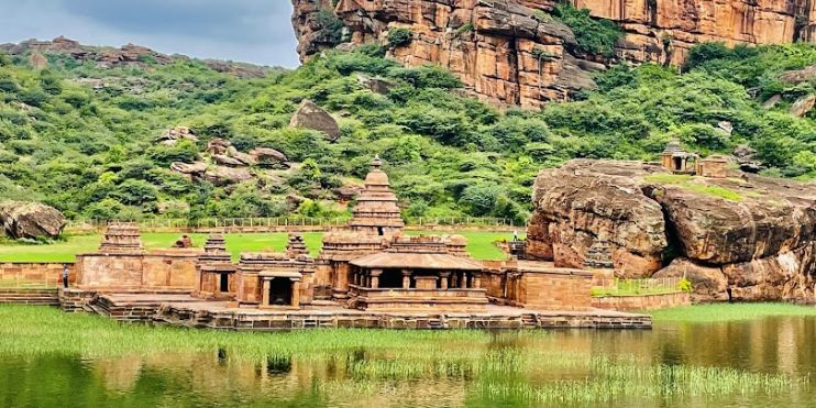 Ancient temples of Hampi surrounded by lush greenery, showcasing Karnataka's rich history and cultural heritage in the rain.