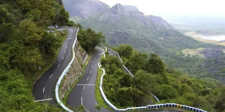 A winding road through dense forests and mountains at Male Mahadeshwara Hills, a serene destination for nature and reflection.